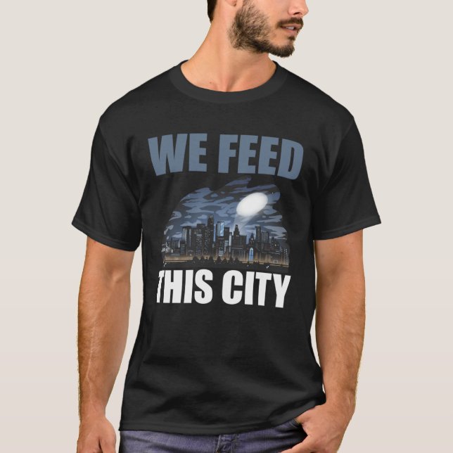Camiseta We Feed This City Food Restaurant Cafeteria (Frente)