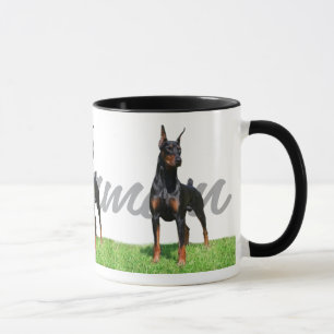 Caneca 3 Pinschers pretos do Doberman com o gráfico do