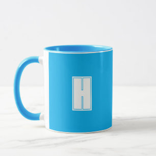 Caneca Azul brilhante inicial branco a frio
