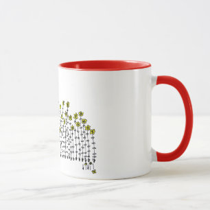 Caneca bonito com bebé em um campo das flores