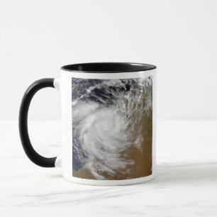 Caneca Ciclone tropical Magda que vem em terra em Austral