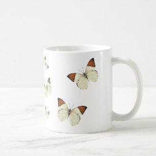 Caneca de café alaranjada das borboletas da ponta