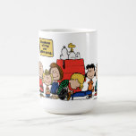 Caneca De Café Amendoins | Felicidade é ser uma das gangues<br><div class="desc">A felicidade é, de fato, parte da gangue dos amendoins, como mostra a amada banda desenhada e suas várias adaptações. Os personagens amendoins, apesar de suas falhas e lutas, encontram alegria em suas amizades e experiências compartilhadas.</div>
