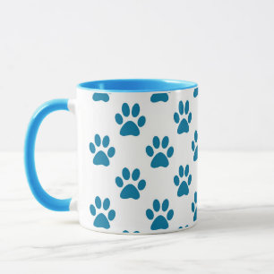 Caneca de café azul do impressão das patas do
