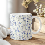 Caneca De Café Boho Marinho Blue Watercolor Flores<br><div class="desc">Comece seu dia com um toque de encanto usando o "Boho Marinho Blue Watercolor Wildflower Coffee Mug". Esta caneca maravilhosamente desenhada apresenta flores silvestres marinhos, azuis, delicadas, pintadas em estilo aquarela, trazendo uma sensação elegante e serena para seu café ou chá matinais. O intrincado padrão floral envolve a caneca, criando...</div>
