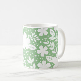 Caneca De Café Desenho Floral Branco em um Fundo Verde Suave