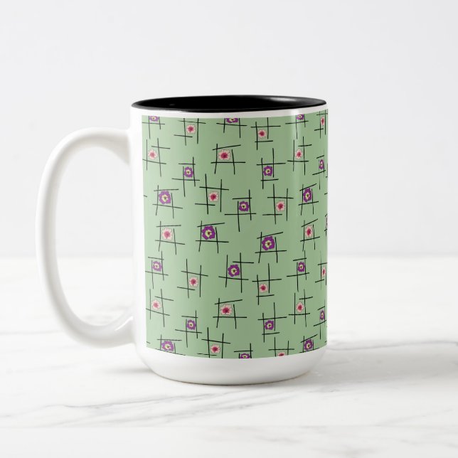 Caneca De Café Em Dois Tons Flores e palitos geométricos sobre fundo verde (Esquerda)