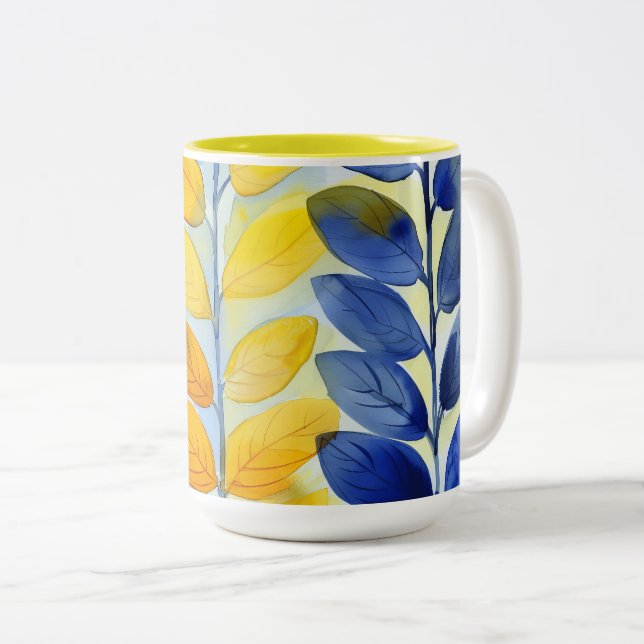 Caneca De Café Em Dois Tons Folhas Amarelas e Azuis (Frente Esquerda)