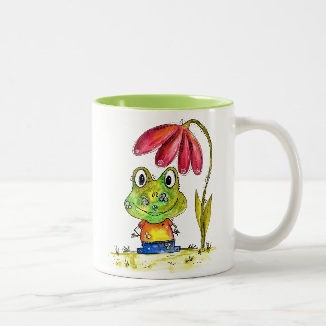 Caneca De Café Em Dois Tons Sapo verde branco sob uma flor vermelha (Direita)