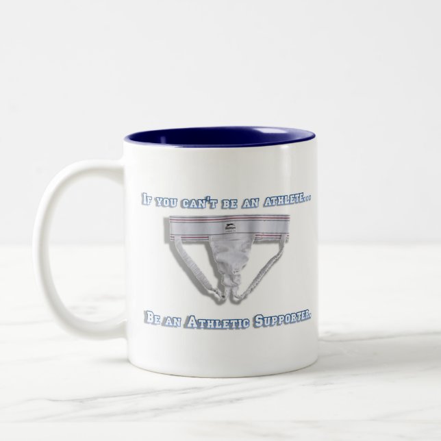 Caneca De Café Em Dois Tons Se você não pode ser um atleta… (Esquerda)