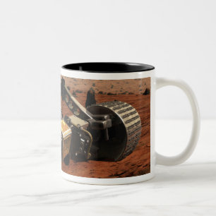 Caneca De Café Em Dois Tons Uma opinião do fim-acima do braço no Marte da NA