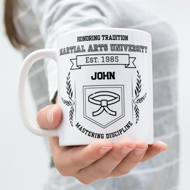 Caneca De Café Em Dois Tons Universidade de Artes Marciais Personalizadas - En (Woman holding a Martial arts university theme mug.)