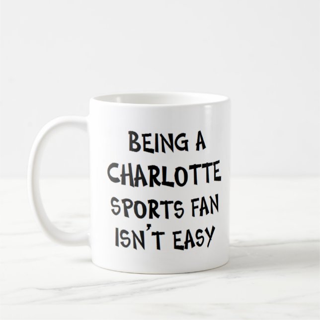 Caneca De Café fã de esportes de charlotte, sendo (Esquerda)