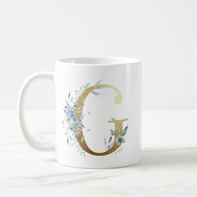 Caneca De Café G ouro inicial com folhagem floral azul (Esquerda)