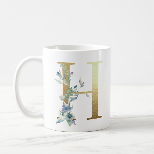 Caneca De Café H ouro inicial com folhagem floral azul (Esquerda)