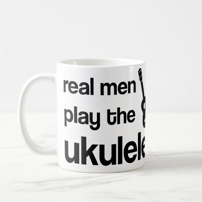 CANECA DE CAFÉ OS HOMENS REAIS JOGAM O UKULELE (Esquerda)