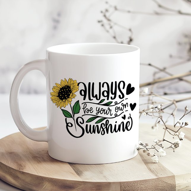 Caneca De Café "Sempre Seja Seu Próprio Sol" Citação De Girassol ("Always Be Your Own Sunshine" Sunflower Quote Coffee Mug on a boho kitchen table with tiny flowers)