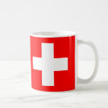 Caneca De Café Suiça Sinalizador Cerâmico<br><div class="desc">Comemore a beleza do eterno e a rica herança da Suiça com esta Suiça Bandeira Cerâmica. Apresentando o icônico fundo vermelho com a cruz branca corajosa, esta caneca é um tributo perfeito ao orgulho e à história nacionais suíços. Quer você esteja apreciando seu café matinal, chá, ou qualquer bebida quente,...</div>