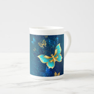 Caneca De Porcelana Borboletas de ouro em um fundo azul