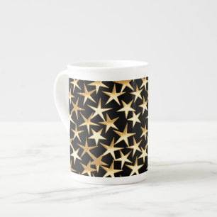 Caneca De Porcelana estrelas Douradas sobre fundo preto