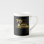 Caneca De Porcelana Golden 70 and still young 70th birthday quote<br><div class="desc">Golden 70 and still young 70th birthday quote, Stay as you are because you are a nice lovable person. Enjoy your life with dignity because this life is all about spreading love and peace. About the design, colorful golden neon chrome colored motivational quote or sayings design for celebrating happy 70th...</div>
