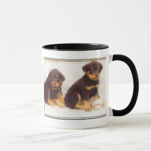 Caneca dos filhotes de cachorro de Rottweiler