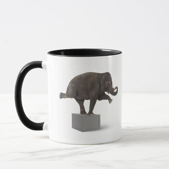 Caneca Elefante que executa o truque na caixa (Esquerda)