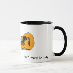 Caneca Eu jogo com minha guitarra quando não faz…