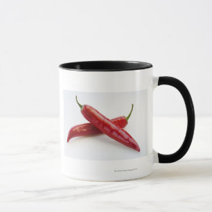 Caneca Feche acima das pimentas de pimentão vermelho