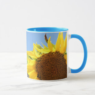 Caneca Girassol e céus azuis