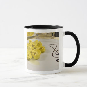 Caneca Itália, Cento. Um prato de tortellini de queijo