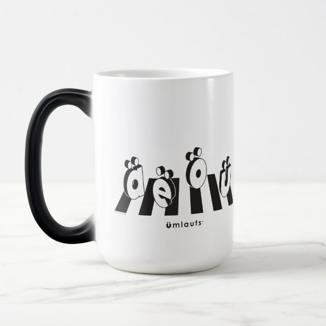 Caneca Mágica “Os Umlauts™ Atravessando” (Esquerda)