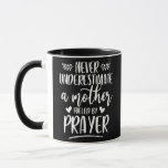 Caneca Never Underestimate A Mother Fueled By Prayer<br><div class="desc">Never Underestimate A Mother Fueled By Prayer Christian Mom Gift. Perfect gift for your dad,  mom,  papa,  men,  women,  friend and family members on Thanksgiving Day,  Christmas Day,  Mothers Day,  Fathers Day,  4th of July,  1776 Independent day,  Veterans Day,  Halloween Day,  Patrick's Day</div>