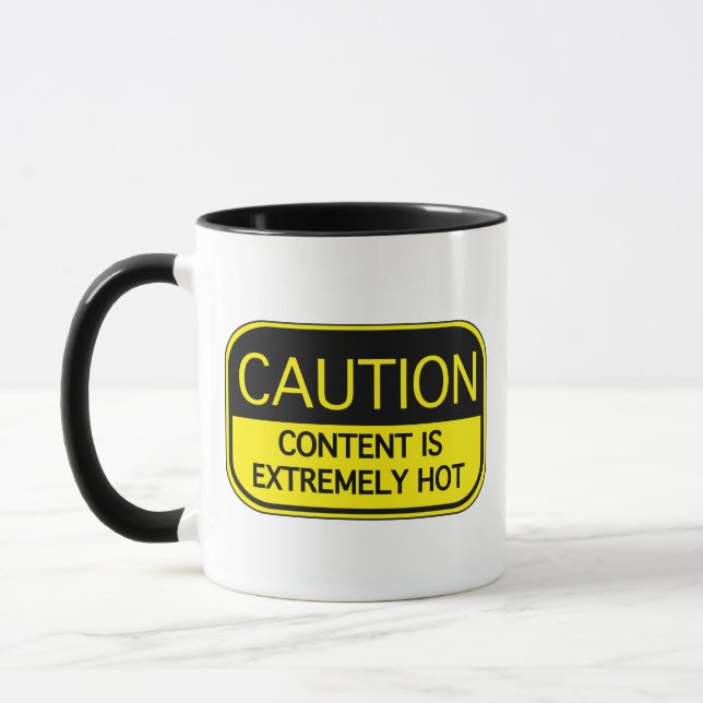 Caneca O Conteúdo De Precaução É Extremamente Quente De C (Esquerda)