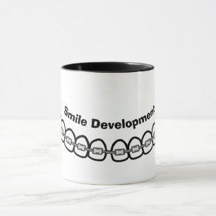 Caneca O Desenvolvimento do Sorriso Traz Mug