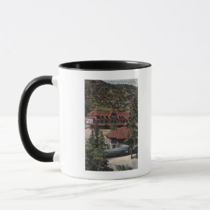 Caneca O ferro salta estação & hotel da estrada da roda