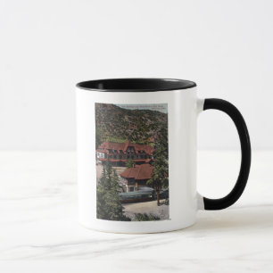 Caneca O ferro salta estação & hotel da estrada da roda