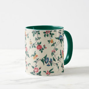 Caneca Padrão de flor multicolorida com acabamento verde,