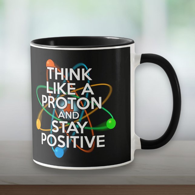 CANECA PENSE COMO UM PRÓTON E PERMANEÇA POSITIVO (THINK LIKE A PROTON AND STAY POSITIVE MUG)