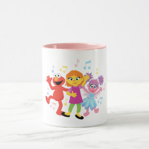 Caneca Rua Sésamo Julia, Elmo & Abby Dançando