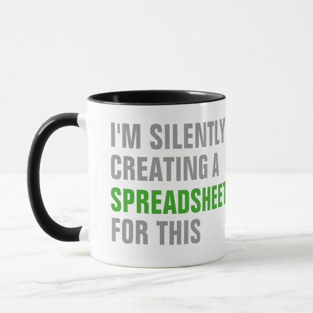 Caneca Silently creating a Spreadsheet for this (Esquerda)