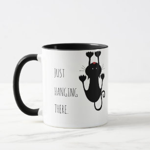 Caneca Só pendurado ali um desenho de um gato preto.