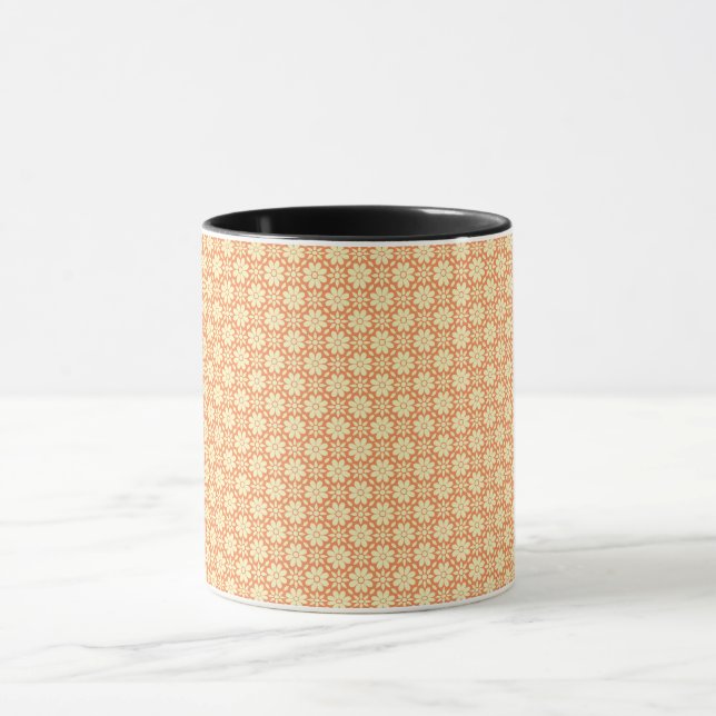 Caneca um fundo laranja e branco com um padrão (Centro)