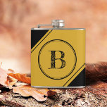 Cantil Initial Monogram Geometric Diagonal Black Gold<br><div class="desc">This flask features a centered double circle in black and gold over a black background. Personalize the text field with an initial letter or customize using the design tool to select a font color,  size,  and style your prefer.</div>