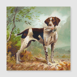 Cão caçador com pássaro na boca