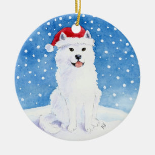 Cão do Samoyed em enfeites de natal do chapéu de