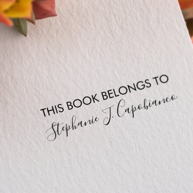 CARIMBO AUTO ENTINTADO ELEGANTE CURSIVO ESTE LIVRO PERTENCE A ADICIONAR O (Cursive Elegant stamp for bookplate with mixed serif and signature-like font)