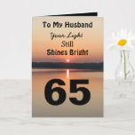 Cartão 65th Birthday Husband Still Shines Bright<br><div class="desc">Give a happy 65th birthday card to your husband to express your “You Still Shine Bright” sentiment. A bold design with a black and gold sunrise on a peaceful lake sends a message of encouragement and love. Read inside the card for an endearing birthday verse for an inspiring sixty-fifth birthday...</div>