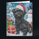 Cartão Affenpinscher Winter Wonderland Natal Joy<br><div class="desc">Este design festivo captura o espírito alegre da época de férias, apresentando um adorável filhote vestindo um chapéu de Papai Noel. O cachorro está aninhado numa terra maravilhosa de inverno, completo com um boneco de neve, uma árvore de Natal decorada, e presentes lindamente envoltos. Os flocos de neve caem suavemente,...</div>