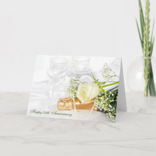 Cartão aniversário de casamento com champanhe e rosa bran